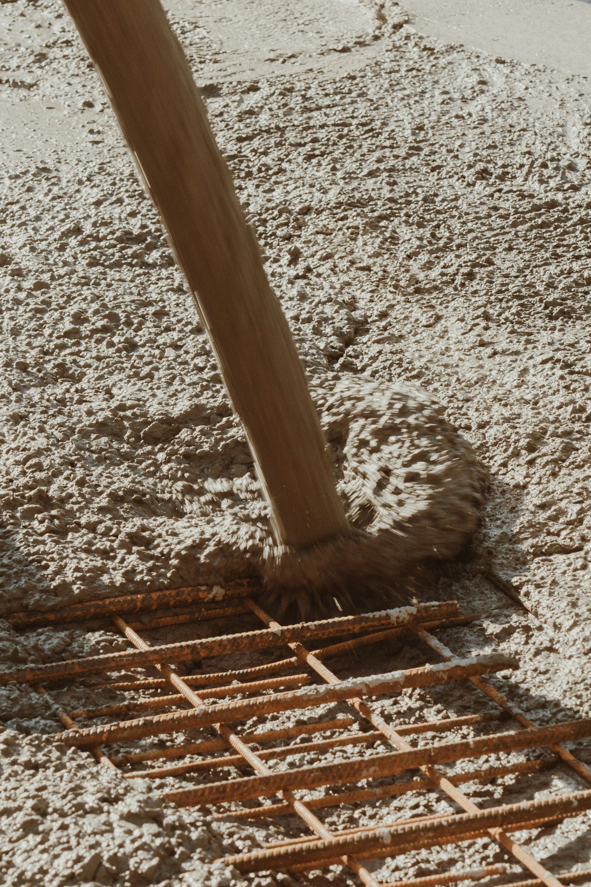 a wooden pole laying on top of a sandy beach